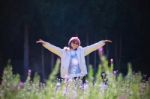 Portrait Of Happiness Asian Woman With Smiling Face In Blooming Flowers Garden Use For Relaxing People In Vacation Traveling Stock Photo