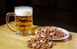 Mug Of Beer And Peanuts Stock Photo