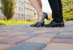 Feet Of Men And Women On A Walk In The Park Stock Photo