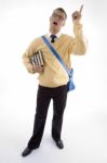 Standing Student Pointing Upwards Stock Photo