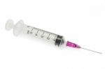 Purple Syringe On White Background Stock Photo