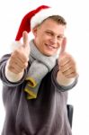 Man Wearing Santa Hat and Thumb Up Stock Photo