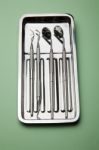 Dental Tools On Plate Stock Photo