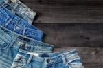 Blue Jean And Jean Lack Texture On The Wooden Floor Stock Photo