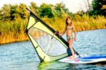 Little Girl Winsurfing On Ada Bojana, Montenegro Stock Photo