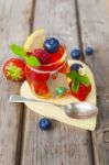 Red And Yellow Jelly Served With Fruit Stock Photo