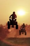 Silhouette Atv Jump On Dirt Tract Stock Photo