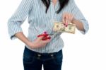 Woman Cutting Ten Dollar Banknote With Scissors Stock Photo