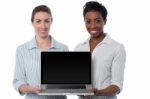 Saleswomen Presenting Brand New Laptop Stock Photo