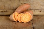 Sweet Potato On The Wooden Background Stock Photo