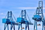 Blue Cargo Cranes At Sea Port Stock Photo