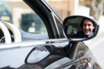 Young Businessman Driving His Car Stock Photo