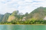 Beautiful High Mountains And Green Lake Stock Photo