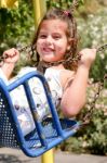 Girl On Swing Stock Photo