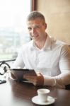 Smiling Businessman On Coffee Break In Restorant Stock Photo