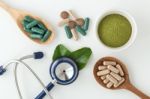 Herbal Medicine In Capsules With Stethoscope Stock Photo