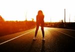 Woman Exercising Outdoor At Sunset  Stock Photo