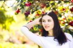 Young Beautiful Woman With Long Straight Dark Hair Posing In Spr Stock Photo