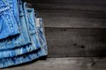 Blue Jean And Jean Lack Texture On The Wooden Floor Stock Photo