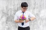 Waiting For His Girlfriend. Close Up Of Handsome Young Man Holdi Stock Photo