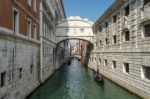 Gondoliers Ferrying People In Venice Stock Photo