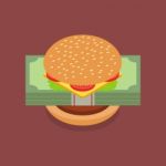 Hamburger With Dollar Banknotes Stock Photo