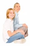 Mum And Son Sat On The Floor Smiling Isolated On White Backgroun Stock Photo