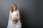 Beautiful Young Asian Bride In Wedding Dress With Flower Bouquet Stock Photo