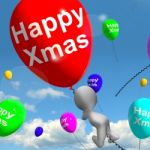 Balloons Floating In The Sky With Happy Xmas Message Stock Photo