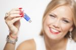 Smiling Woman With Usb Memory In Hands Stock Photo