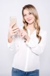 Casual Pretty Woman Taking A Selfie Stock Photo