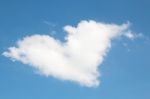 Heart Shaped White Cloud On Blue Sky Background Stock Photo