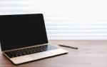 Laptop On Office Table Stock Photo