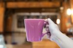 Woman Hand Holding Coffee Cup In Coffee Shop Stock Photo