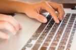 Typing On Keyboard Laptop At Work Table Stock Photo