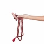 Rudraksha Rosary In A Female Hand. Japa Mala Stock Photo