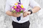 Waiting For His Girlfriend. Close Up Of Handsome Young Man Holdi Stock Photo