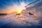 Very Large And Beautiful Chunk Of Ice At Sunrise In Winter Stock Photo