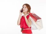 Girl With Gift Bags Speaks By Mobile Phone Stock Photo