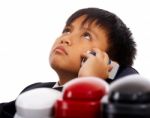 Boy With Many Telephones Stock Photo