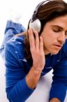 Front View Of Man Tuned In Music Stock Photo