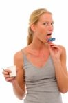 Licking Yogurt Pot Lid Stock Photo