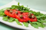 Salad With Fresh Tomatoes, Capers And Arugula Stock Photo