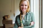 Young Beautiful Woman Moving In A New Home Stock Photo