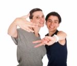 Sisters Showing Victory Sign Stock Photo