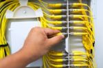 People Fix Node Fiber Optic In Network Room Stock Photo