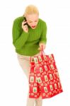 Christmas Shopper On Mobile Phone Stock Photo