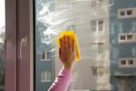 Female Hand Washing A Window Stock Photo