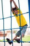 Young Kid On Playstructure Stock Photo