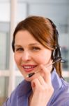 Young Businesswoman With Headset Stock Photo